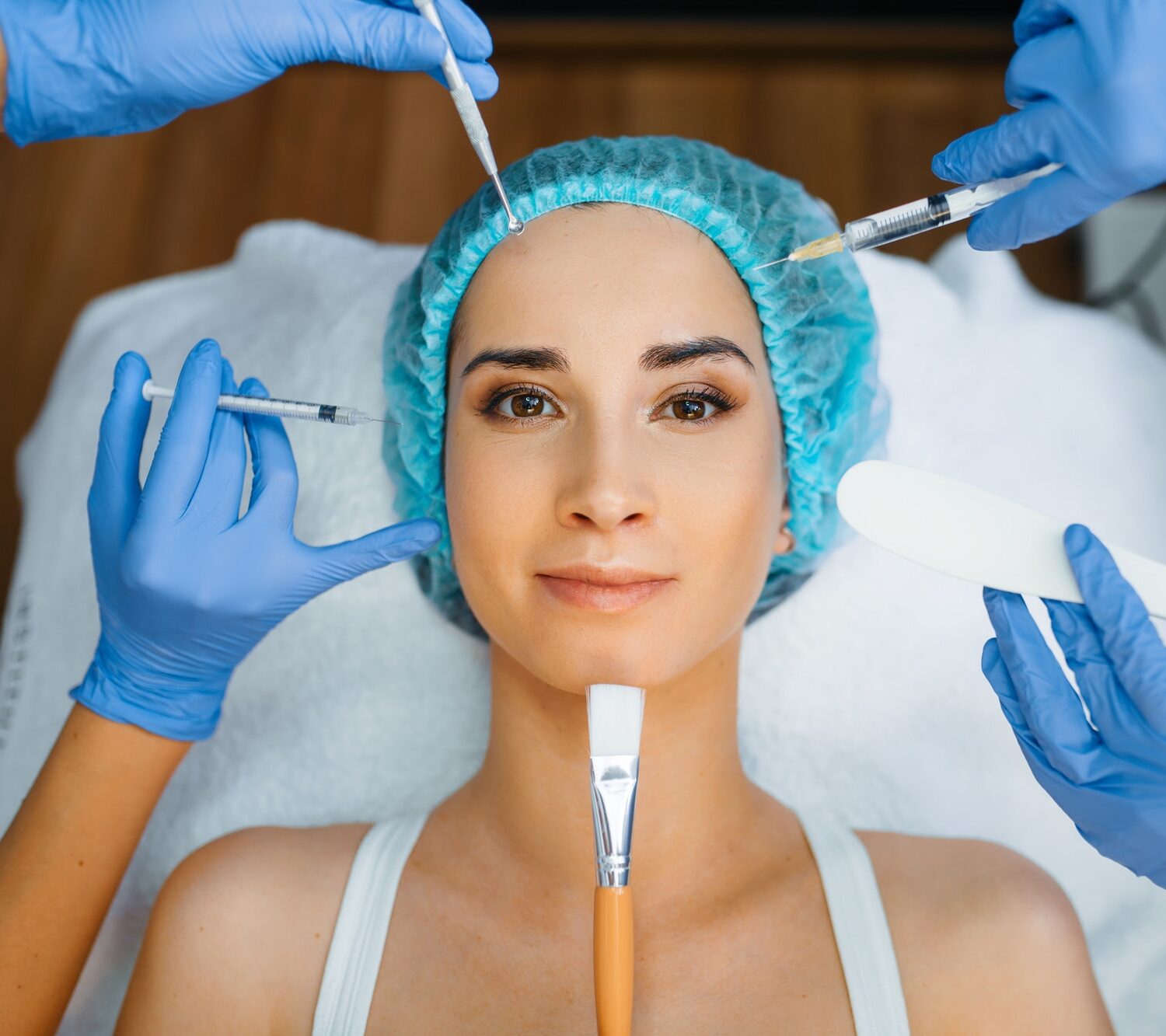 cosmetician-hands-with-working-tools-patient-face.jpg